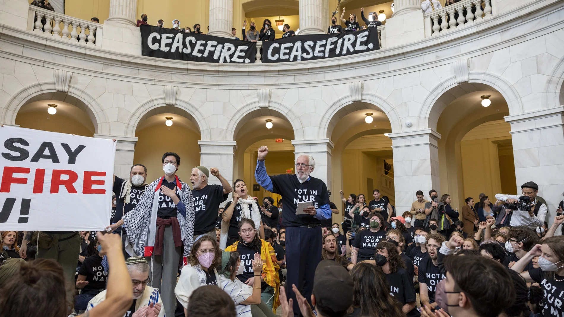 Demonstrators, calling for a ceasefire in the ongoing war between Israel and Hamas, protest inside the Cannon House Office Building at the Capitol in Washington.
