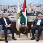 Iranian Foreign Minister Hossein Amir-Abdollahian (L) and Palestinian Islamist group Hamas leader Ismail Haniyeh (R) during a meeting in Doha, Qatar.