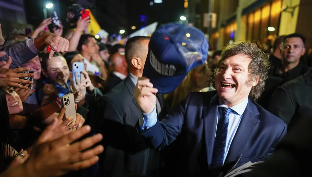 Javier Milei, presidential candidate of the Liberty Advances coalition, greets supporters at his campaign headquarters after polls closed for general elections in Buenos Aires, Argentina.