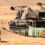  An Israeli soldiers walks past a M109-type self-propelled howitzer, upgraded version for IDF called 'Doher', as Israel prepares for the scenario of ground maneuvers at an undisclosed location near the border with Gaza, in Israel, 25 October 2023.