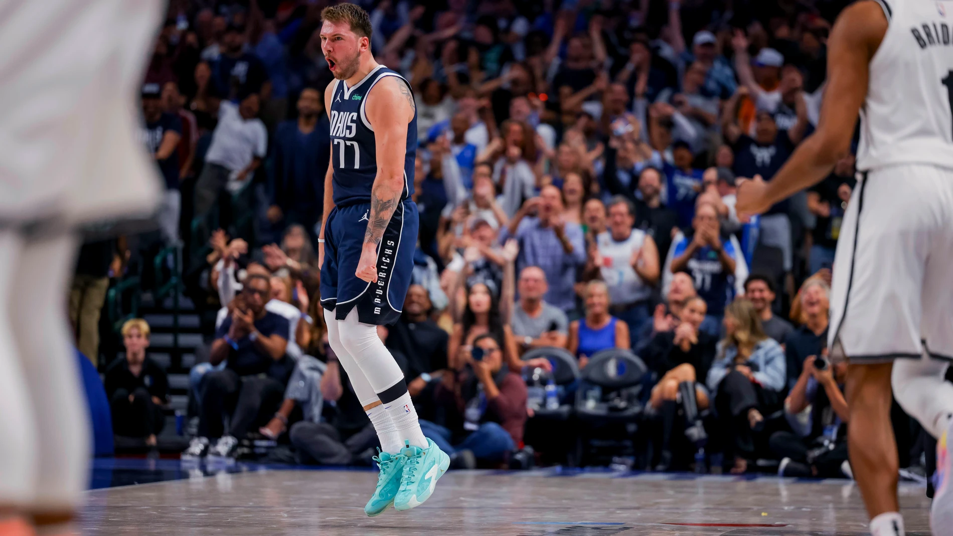 Dallas Mavericks guard Luka Doncic (77) celebrates hitting a 3-point basket against the Brooklyn Nets during the second half of an NBA basketball game Friday, Oct. 27, 2023, in Dallas. (AP Photo/Gareth Patterson)