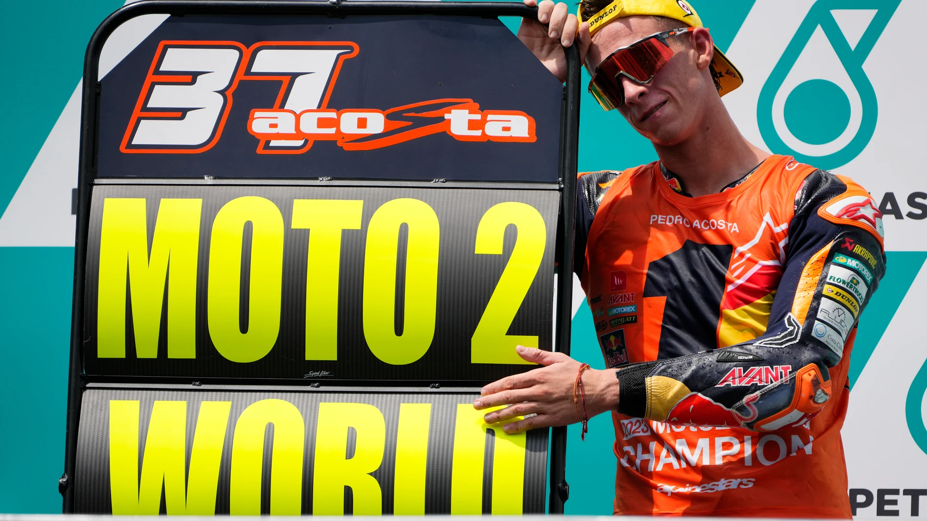 Spanish rider Pedro Acosta celebrates as he secured his 2023 Moto2 World Championship title after the Moto2 class race of the MotoGP Malaysian Grand Prix at the Sepang, Malaysia Sunday, Nov. 12, 2023. (AP Photo/Vincent Thian)