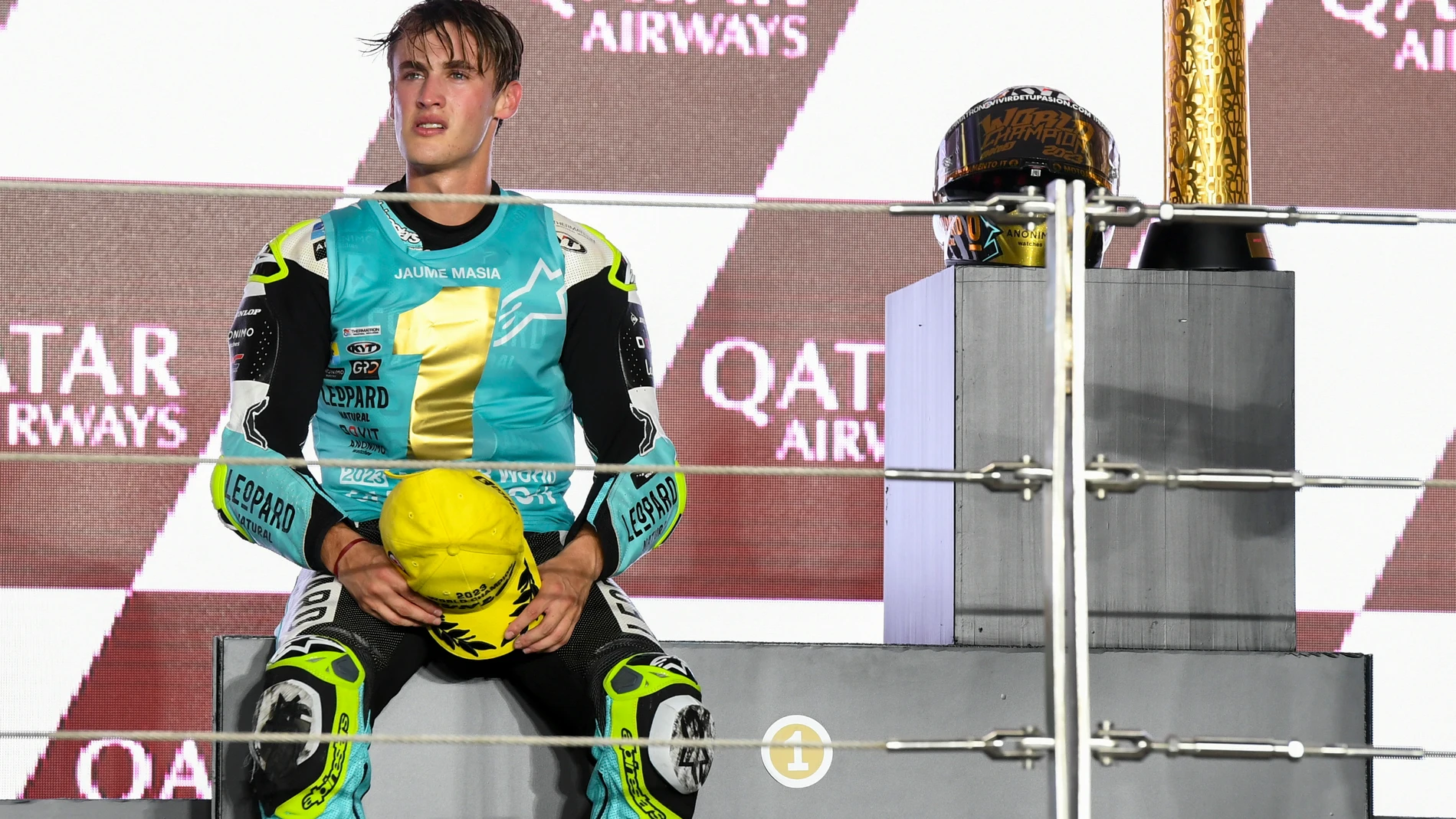 Doha (Qatar), 19/11/2023.- Spanish Moto3 rider Jaume Masia of Leopard Racing celebrates his victory on the podium after the Moto3 race of the Motorcycling Grand Prix of Qatar at the Losail International Circuit in Doha, Qatar, 19 November 2023. (Motociclismo, Ciclismo, Catar) EFE/EPA/NOUSHAD THEKKAYIL