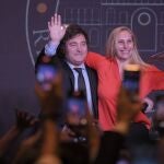 Buenos Aires: Javier Milei (L), presidential candidate of the libertarian party La Libertad Avanza, and his sister Karina Milei wave at the campaign headquarters after their party's victory in the run-off election