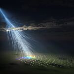 Ilustración artística de la partícula cósmica extremadamente energética observada por un conjunto de detectores de superficie del experimento Telescope Array, denominada "partícula Amaterasu". 