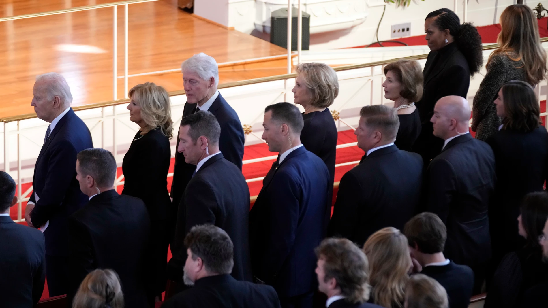 From left, President Joe Biden, first lady Jill Biden, former President Bill Clinton, former Secretary of State Hillary Clinton, former first lady Laura Bush, former first lady Michelle Obama and former first lady Michelle Obama prepare to depart after a tribute service for former first lady Rosalynn Carter, at Glenn Memorial Church, Tuesday, Nov. 28, 2023, in Atlanta. (AP Photo/Andrew Harnik)