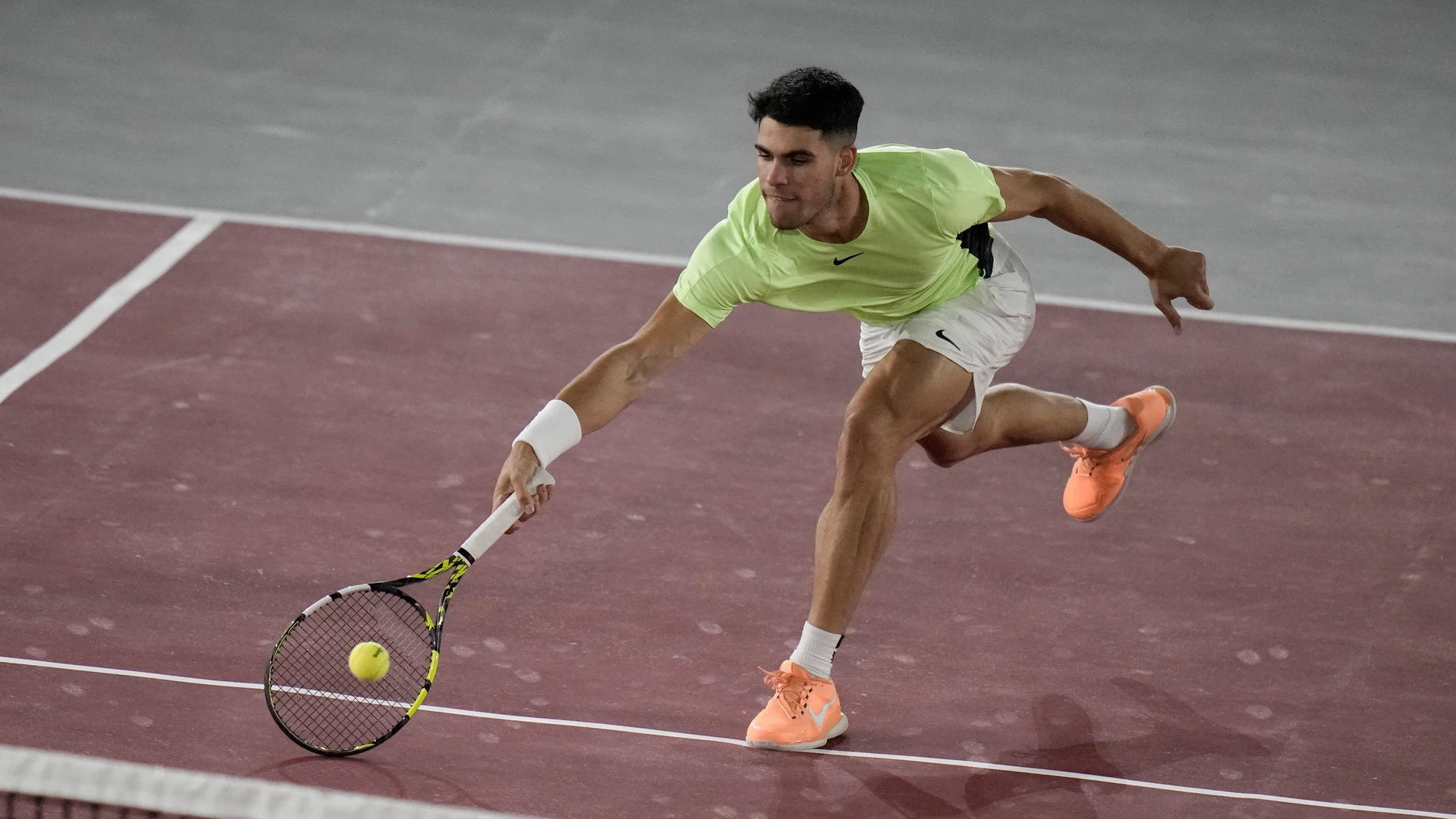 Spain's Carlos Alcaraz returns the ball during an exhibition tennis match against Tommy Paul of the United States at the Plaza de Toros bullring in Mexico City, Wednesday, Nov. 29, 2023. (AP Photo/Eduardo Verdugo)