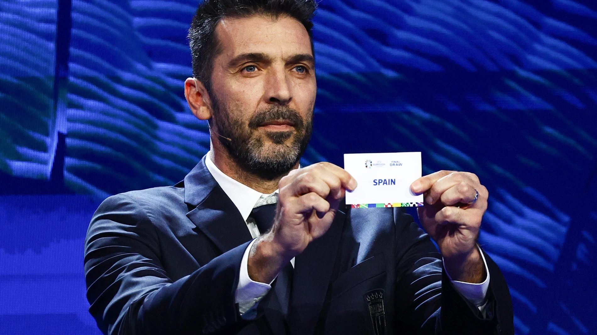 Hamburg (Germany), 02/12/2023.- Italian former football player Gianluigi Buffon holds a ticket of Spain during the UEFA EURO 2024 final tournament draw at the Elbphilharmonie in Hamburg, Germany, 02 December 2023. The UEFA EURO 2024 will take place in Germany from 14 June to 14 July. (Alemania, España, Hamburgo) EFE/EPA/FILIP SINGER 