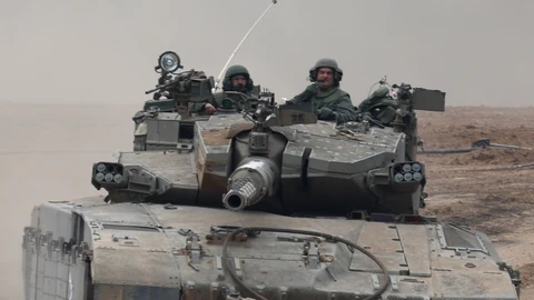 Israeli forces move along the central Gaza border