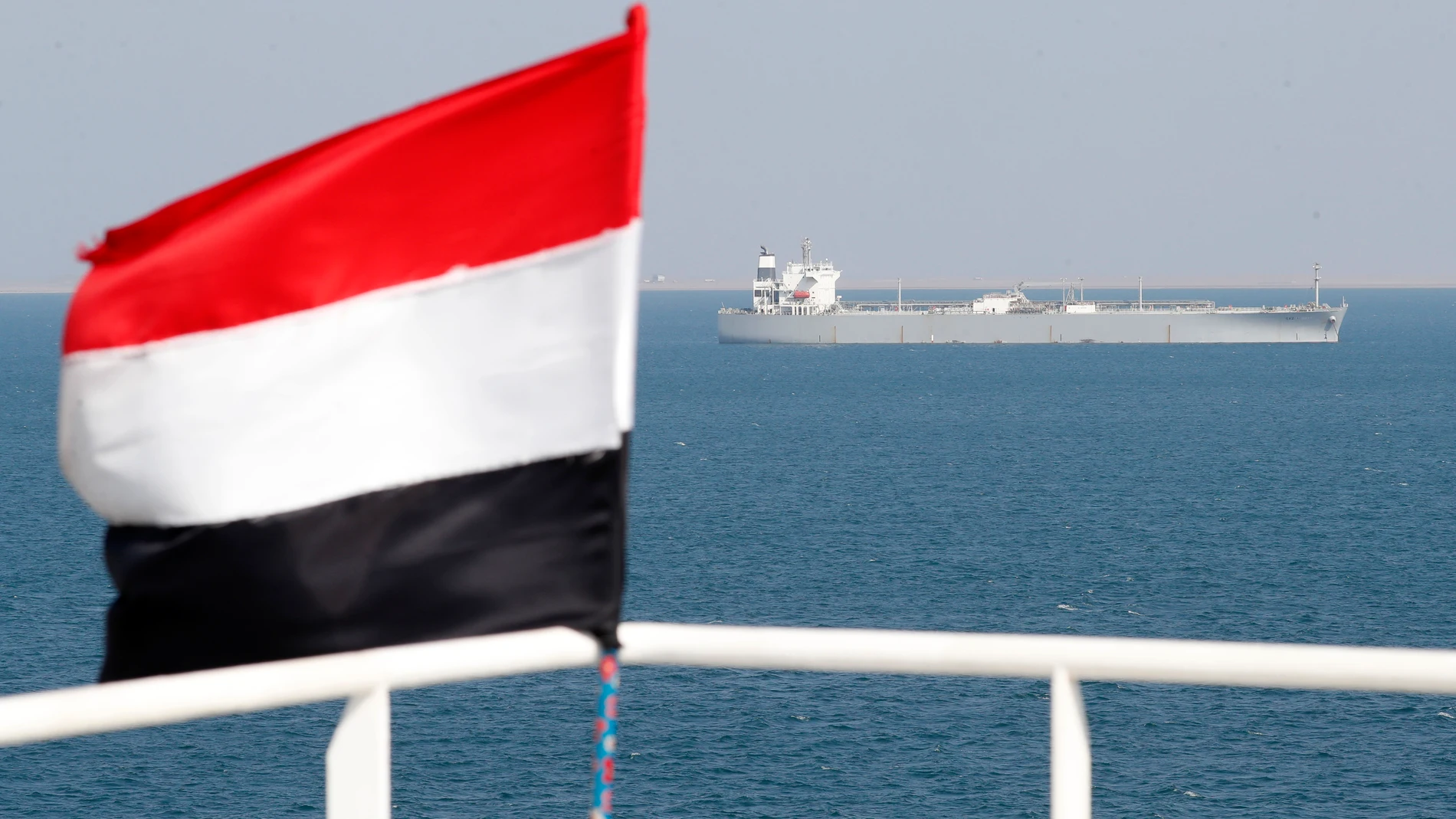 Hodeidah (Yemen), 05/12/2023.- A ship sails offshore of the Al-Salif port as a Yemeni flag flutters on the deck of the Galaxy Leader cargo ship, seized by the Houthis, on the Red Sea in the province of Hodeidah, Yemen, 05 December 2023 (issued 06 December 2023). Yemen's Houthis on 06 December 2023 claimed responsibility for the launch of the barrage of ballistic missiles toward Israel in support of the Palestinian people in the Gaza Strip, according to a statement by Houthis spokesman Yahya S...