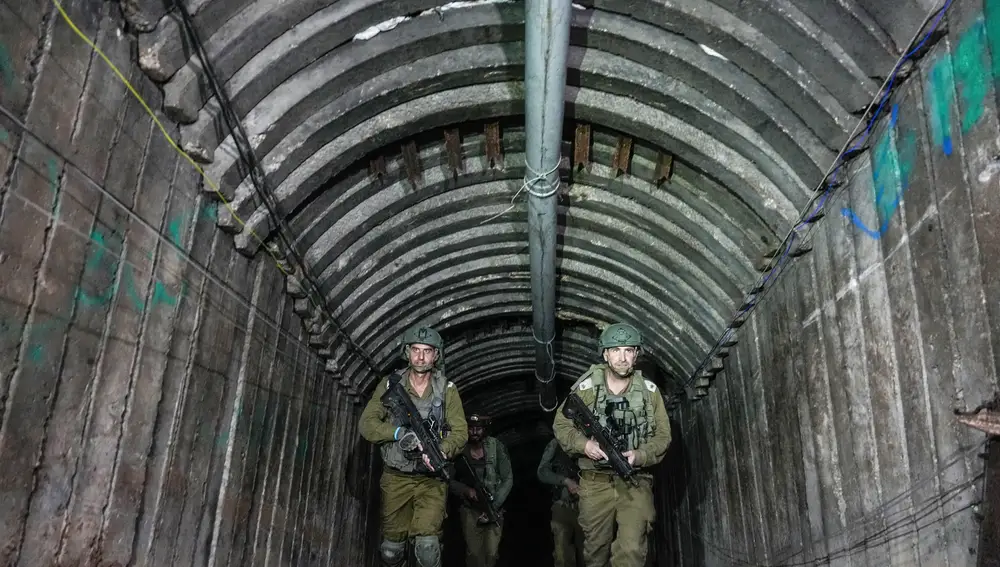 Israeli soldiers are seen in a tunnel that the military says Hamas militants used to attack the Erez crossing in the northern Gaza Strip, Friday, Dec. 15, 2023.
