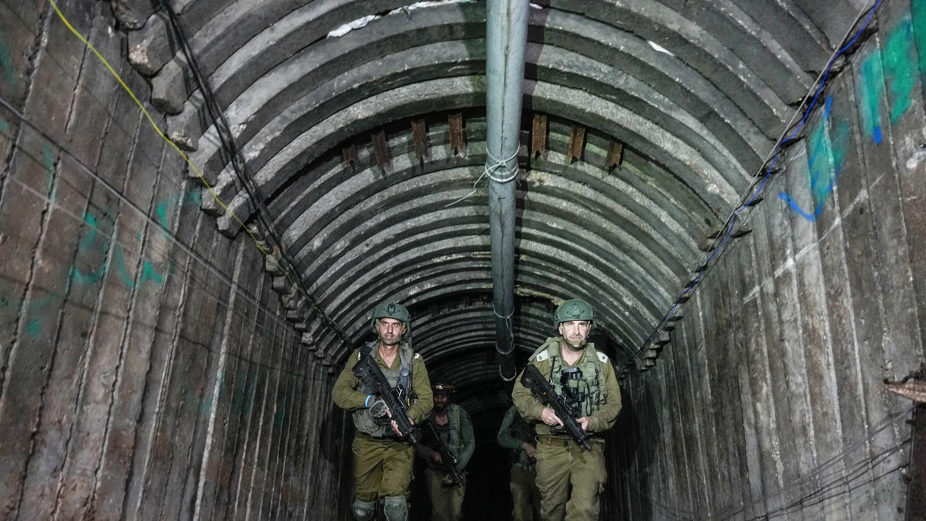 Israeli soldiers are seen in a tunnel that the military says Hamas militants used to attack the Erez crossing in the northern Gaza Strip, Friday, Dec. 15, 2023.