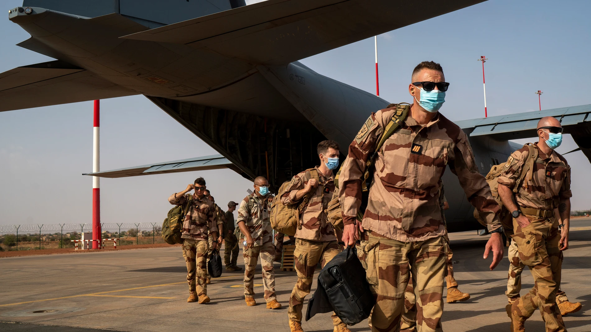 FILE - French soldiers disembark from a U.S. Air Force C130 cargo plane at Niamey, Niger base, on June 9, 2021. France on Friday Dec. 22, 2023 completed the withdrawal of its troops who were asked to leave Niger by the country’s new junta, ending years of on-the-ground military support and raising concerns from analysts about a gap in the fight against jihadi violence across Africa’s Sahel. (AP Photo/Jerome Delay, File)