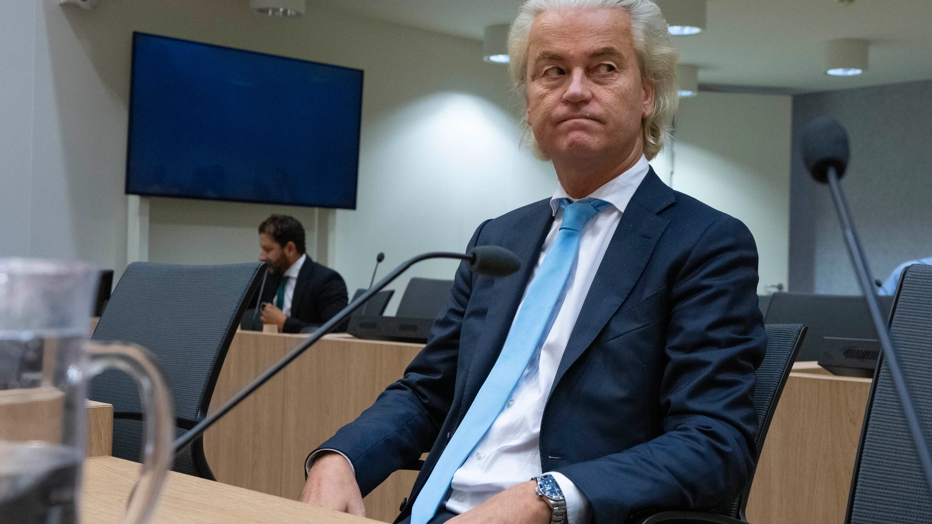 FILE - Politician Geert Wilders listenes, as the court delivers it's verdict against a former Pakistan cricketer accused of incitement to kill, at the high security court building near Schiphol airport, Monday, Sept. 11, 2023. Far right Dutch election winner Geert Wilders on Monday withdrew proposed legislation calling for a ban on mosques and the Quran — in a concession to potential coalition partners a day before talks to form the next government were set to resume. (AP Photo/Peter Dejong),...