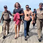 A Spanish chef alleged murder suspect Daniel Sancho Bronchalo (2-L), is escorted by Thai police officers as they arrive at a port before going to the court in Koh Samui island, southern Thailand