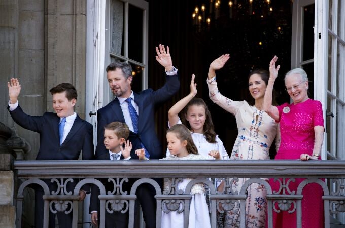 Denmark's Crown Prince Frederik (2-L), Crown Princess Mary (2-R), their children and Queen Margrethe II (R) wave on the balcony of Amalienborg Castle on the Crown Prince's 50th birthday, in Copenhagen, Denmark