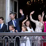 Denmark&#39;s Crown Prince Frederik (2-L), Crown Princess Mary (2-R), their children and Queen Margrethe II (R) wave on the balcony of Amalienborg Castle on the Crown Prince&#39;s 50th birthday, in Copenhagen, Denmark
