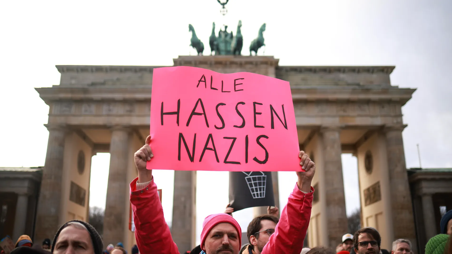 Berlin (Germany), 14/01/2024.- A protester holds a placard reading 'All hate Nazis' during a demonstration against the far-right Alternative for Germany (AfD) party in front of the Brandenburg Gate in Berlin, Germany, 14 January 2024. The protest held under the slogan 'Defend Democracy', was organized by the Fridays for Future movement, along with other non-governmental organizations, as a reaction to revelations of the investigative journalism group Correctiv, and their report about a meetin...