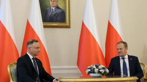 Polish President Andrzej Duda (L) and Prime Minister Donald Tusk (R) during a meeting at the Presidential Palace in Warsaw, Poland, 15 January 2024.