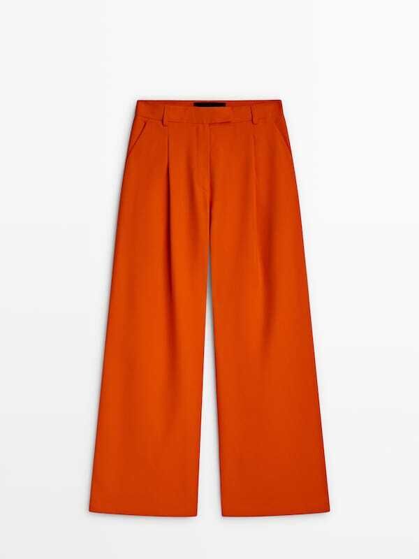 Pantalones de pinza en naranja.