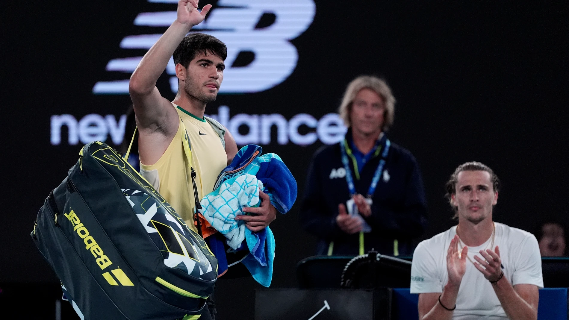 Carlos Alcaraz of Spain waves as he leaves Rod Laver Arena following his quarterfinal loss to Alexander Zverev of Germany at the Australian Open tennis championships at Melbourne Park, Melbourne, Australia, early Thursday, Jan. 25, 2024. (AP Photo/Andy Wong)