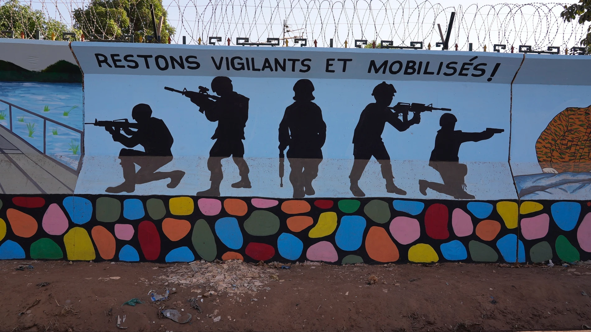 FILE - A mural is seen in Ouagadougou, Burkina Faso, on March 1, 2023. A new report by Human Rights Watch says Burkina Faso’s security forces killed at least 60 civilians in three different drone strikes which the West African nation’s military government claimed were targeting extremists. (AP Photo, File)