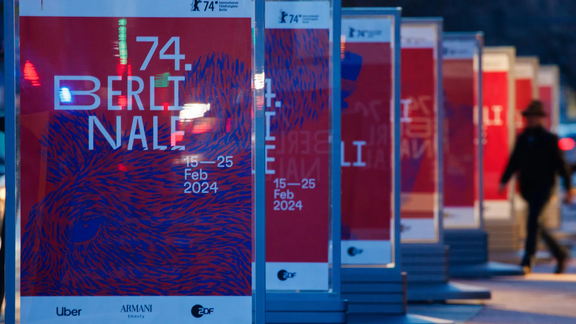 Berlin (Germany), 29/01/2024.- A passers-by walks near Berlinale posters at Potsdamer Platz square in Berlin, Germany, 29 January 2024. The 2024 edition of the upcoming Berlin International Film Festival 'Berlinale' will run from 15 to 25 February. (Cine, Alemania) EFE/EPA/CLEMENS BILAN 