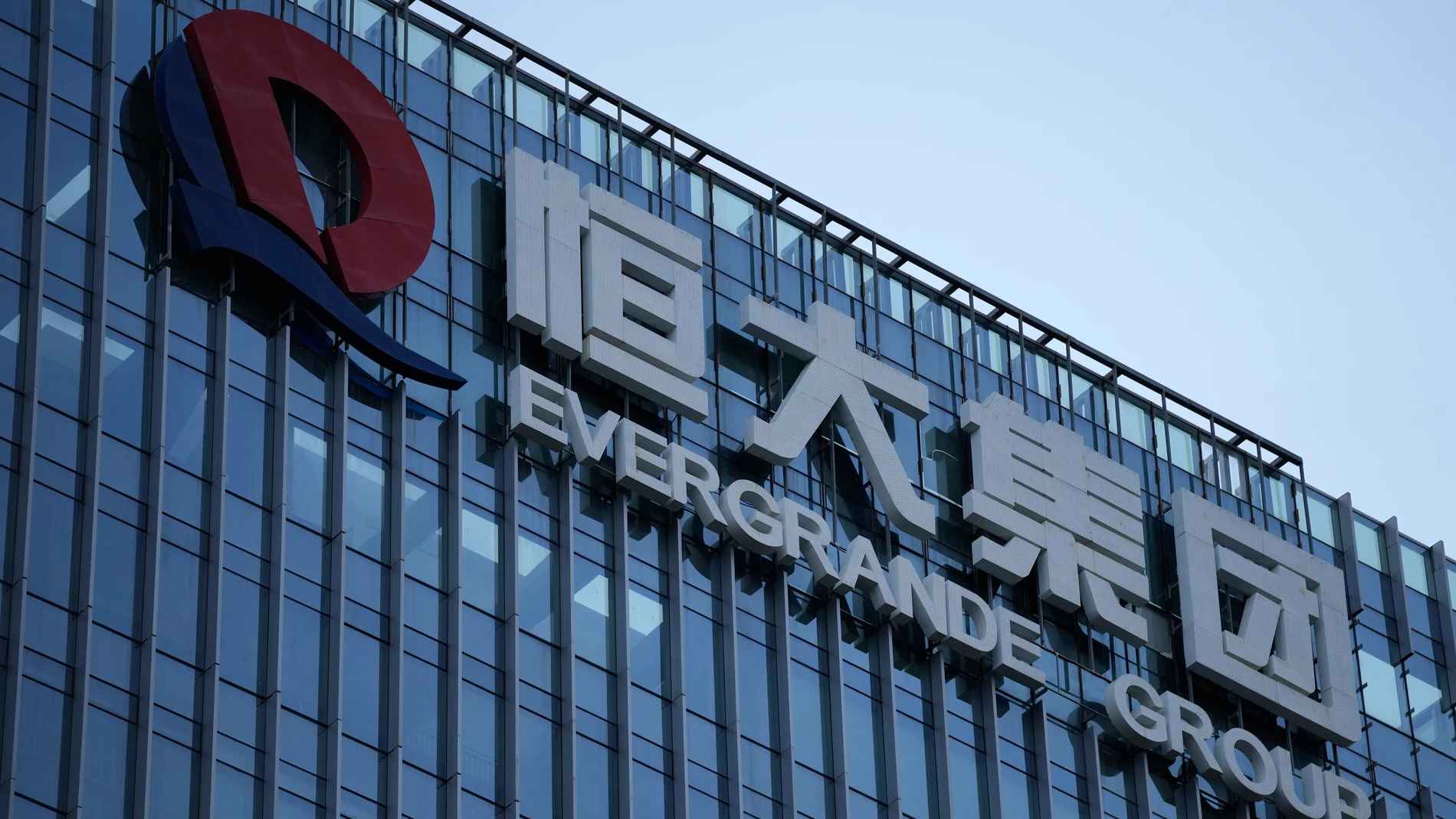 FILE - The Evergrande Group headquarters logo is seen in Shenzhen in southern China's Guangdong province, Friday, Sept. 24, 2021. Chinese property developer China Evergrande Group on Monday, Jan. 29, 2024 was ordered to liquidate by a Hong Kong court, after the firm was unable to reach a restructuring deal with creditors. (AP Photo/Ng Han Guan, File)