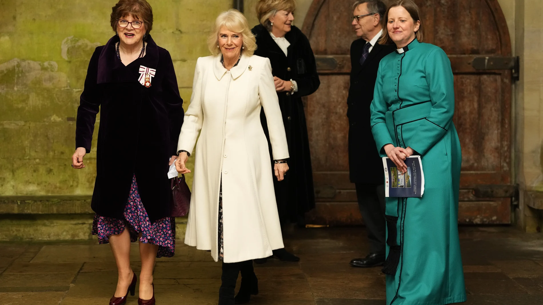 Britain's Queen Camilla arrives and is escorted as she attends a Musical Evening at Salisbury Cathedral, Salisbury, England, Thursday, Feb. 8, 2024, to celebrate the work of local charities. (AP Photo/Kirsty Wigglesworth, Pool)