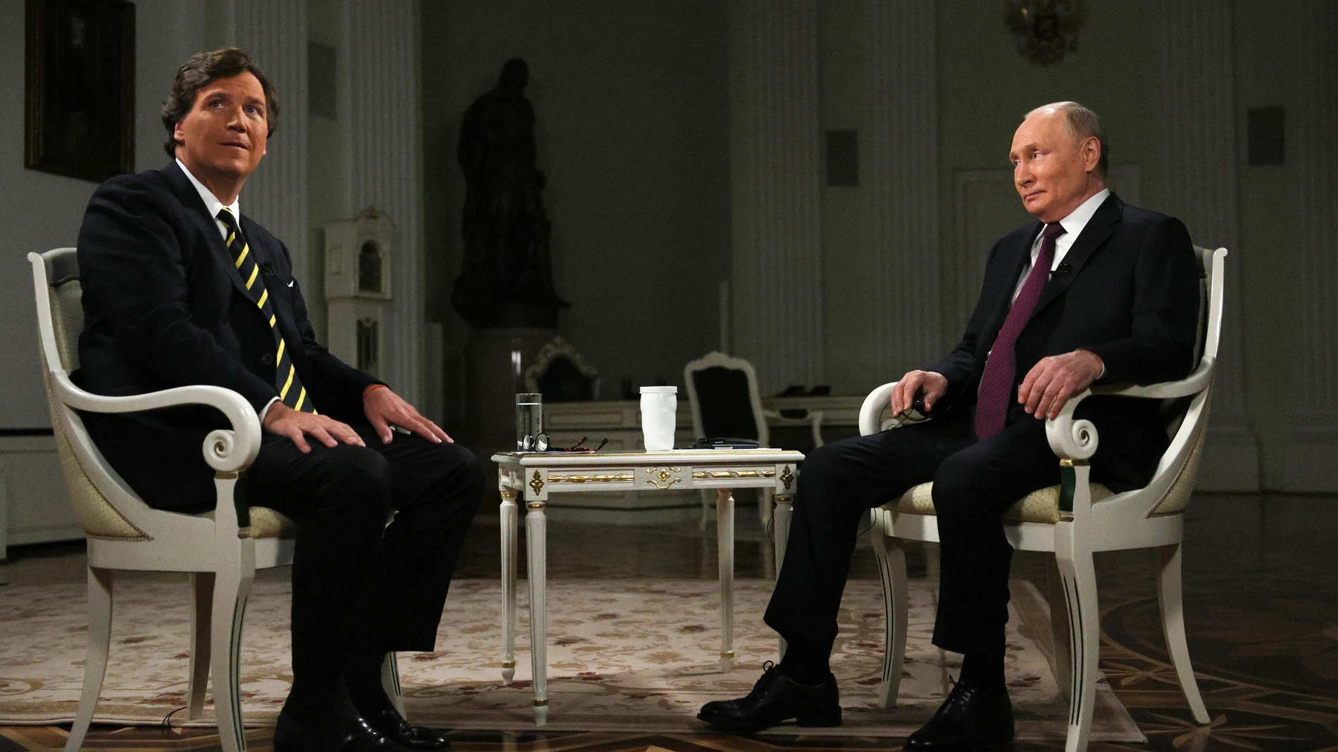 In this photo released by Sputnik news agency on Friday, Feb. 9, 2024, Russian President Vladimir Putin, right, and former Fox News host Tucker Carlson prepare to an interview at the Kremlin in Moscow, Russia, Tuesday, Feb. 6, 2024. (Gavriil Grigorov, Sputnik, Kremlin Pool Photo via AP)