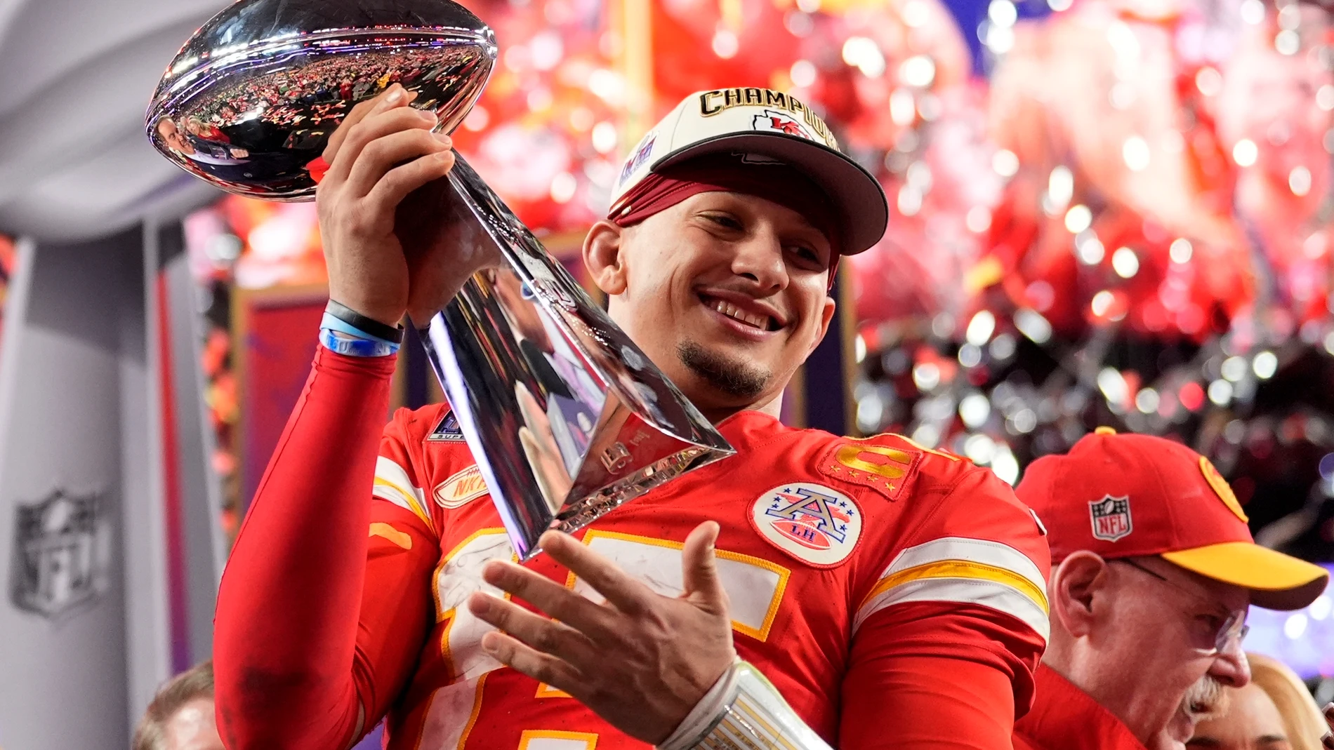 Kansas City Chiefs quarterback Patrick Mahomes celebrates with the trophy after the team's win in overtime during the NFL Super Bowl 58 football game against the San Francisco 49ers on Sunday, Feb. 11, 2024, in Las Vegas. The Chiefs won 25-22. (AP Photo/Ashley Landis)