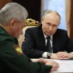 Russian President Vladimir Putin meets with Russian Defence Minister Sergei Shoigu