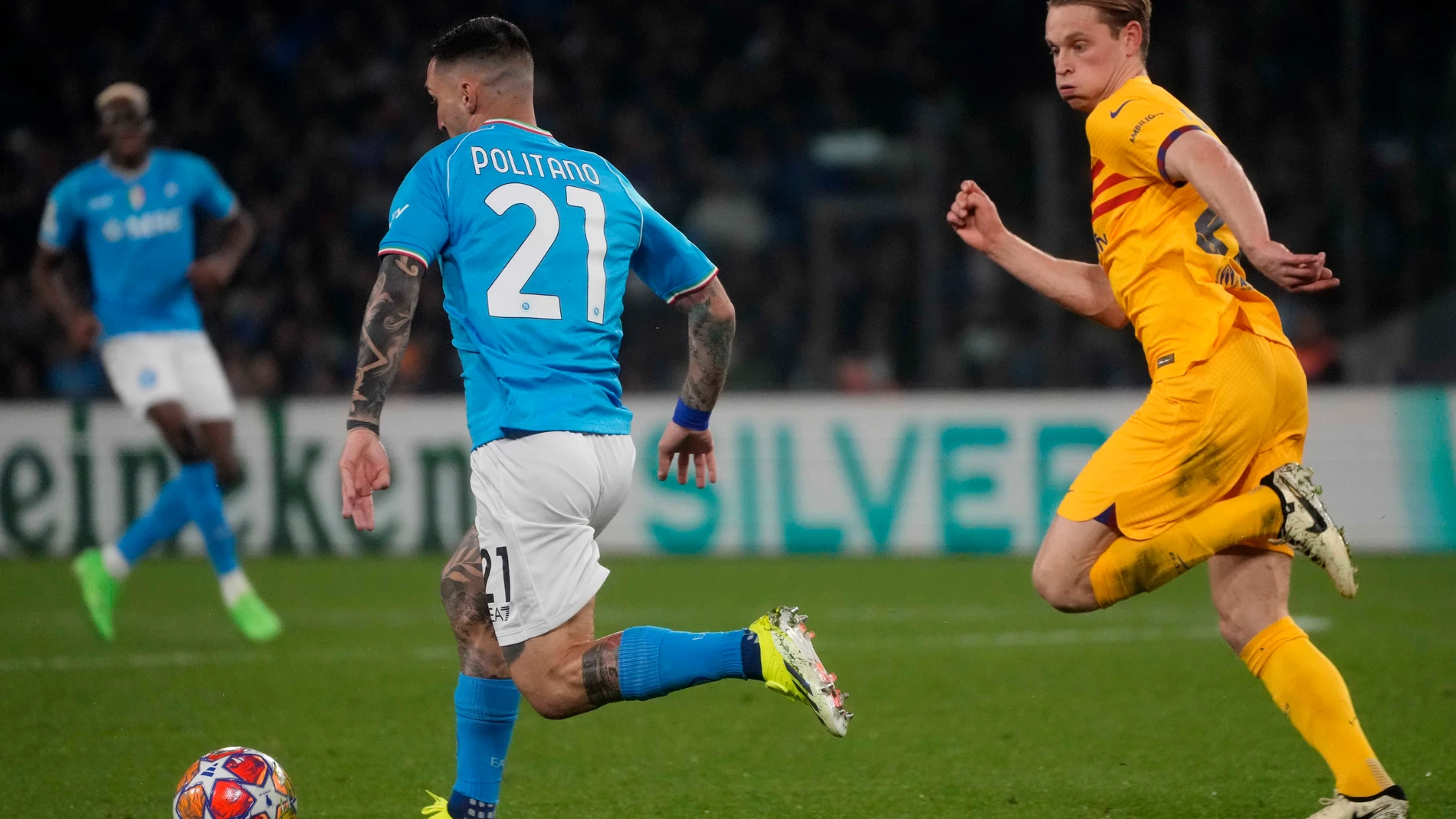Barcelona's Frenkie de Jong, right, and Napoli's Matteo Politano challenge for the ball during the Champions League, round of 16, first leg soccer match between SSC Napoli and FC Barcelona at the Diego Maradona stadium in Naples, Italy, Wednesday, Feb. 21, 2024. (AP Photo/Gregorio Borgia)