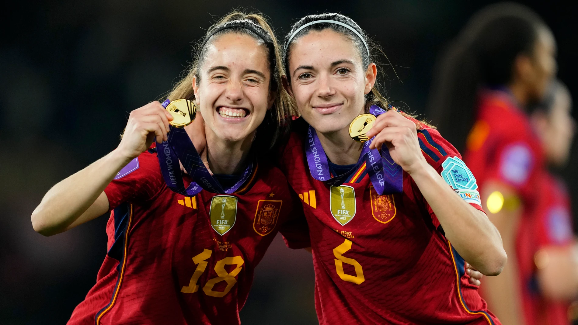 Spain's Maite Oroz and Aitana Bonmati, right, pose with their medals after winning the Women's Nations League final soccer match between Spain and France at La Cartuja stadium in Seville, Spain, Wednesday, Feb. 28, 2024. Spain won 2-0. (AP Photo/Jose Breton)