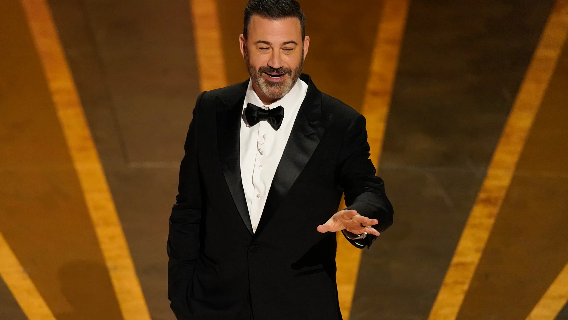 FILE - Host Jimmy Kimmel speaks at the Oscars on March 12, 2023, at the Dolby Theatre in Los Angeles. Kimmel will host the 96th Oscars on Sunday. (AP Photo/Chris Pizzello, File)