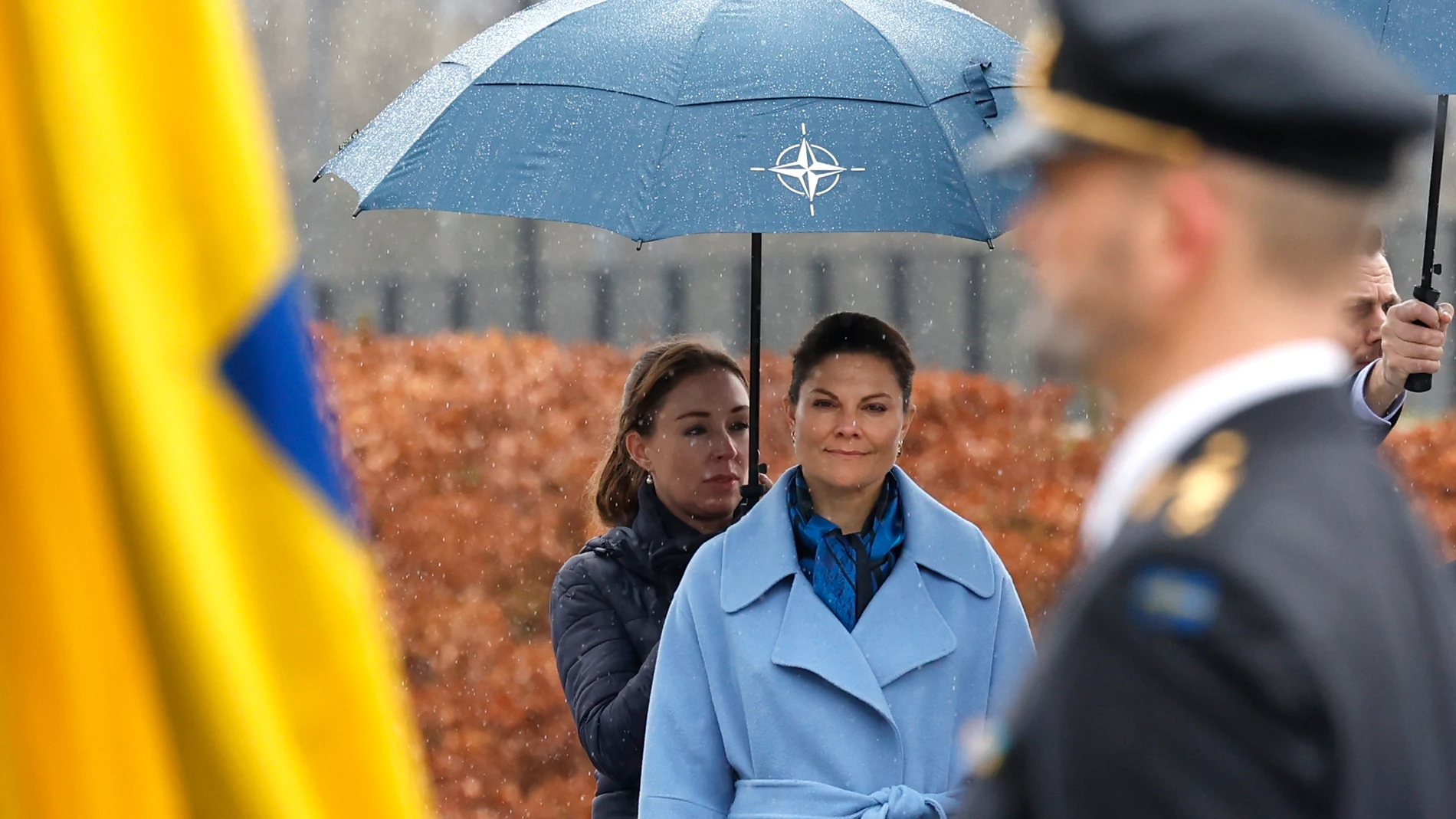Sweden's Crown Princess Victoria, center, watches as members of the military prepare to raise the flag of Sweden during a ceremony to mark the accession of Sweden to NATO at NATO headquarters in Brussels, Monday, March 11, 2024. (AP Photo/Geert Vanden Wijngaert)