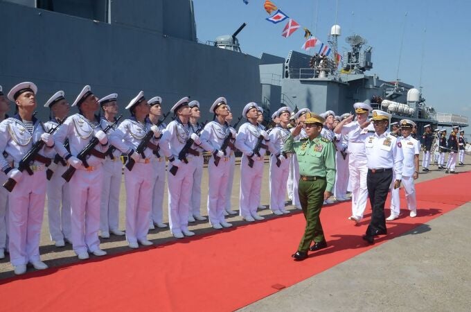 Myanmar's military chief Min Aung Hlaing (C) saluting Russian Navy personnel ahead of joint maritime exercises at Thilawa Port in Yangon.
