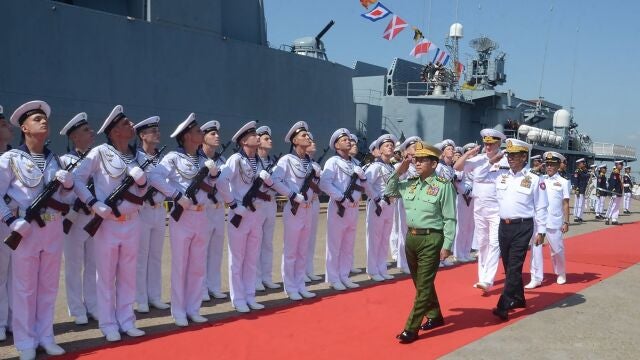 Myanmar's military chief Min Aung Hlaing (C) saluting Russian Navy personnel ahead of joint maritime exercises at Thilawa Port in Yangon.