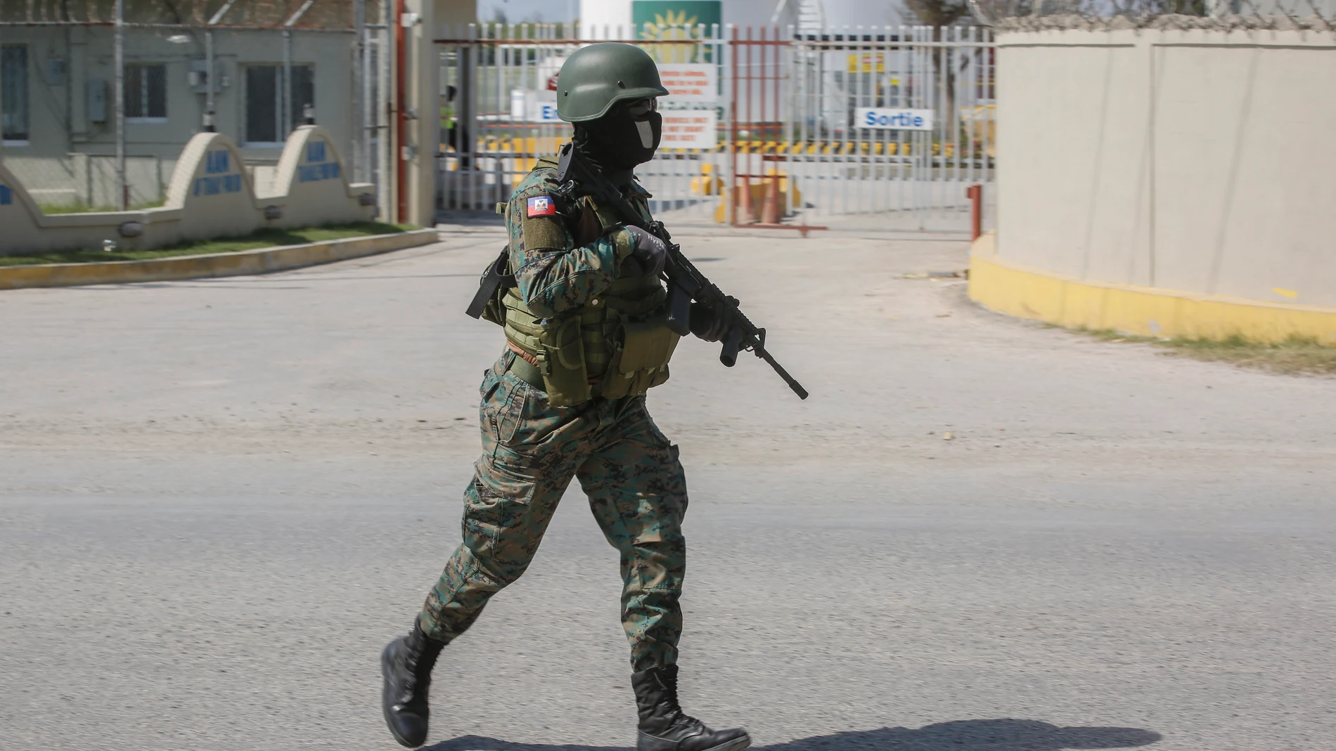 A soldier guards the entrance of the international airport in Port-au-Prince, Haiti, Wednesday, March 13, 2024. (AP Photo/Odelyn Joseph)