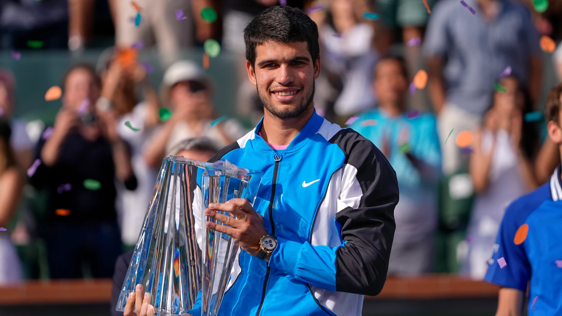 Carlos Alcaraz, of Spain, holds the trophy after defeating Daniil Medvedev, of Russia, in the final match at the BNP Paribas Open tennis tournament, Sunday, March 17, 2024, in Indian Wells, Calif. (AP Photo/Ryan Sun)