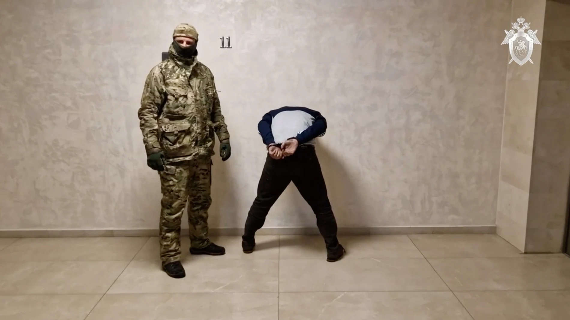 Moscow (Russian Federation), 24/03/2024.- A still image taken from a handout video made available by the Russian Investigative Committee Press-Service shows a Russian investigator escorting a detained suspect in the Crocus City Hall shooting attack, at the Russian Investigative Committee headquarters in Moscow, Russia, 24 March 2024. On 24 March, Russia observed a day of national mourning for the victims of the terrorist attack in Krasnogorsk's Crocus City Hall. At least 152 people were kille...