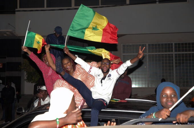 Supporters of Diomaye Faye rally in Dakar as presidential election results are tallied