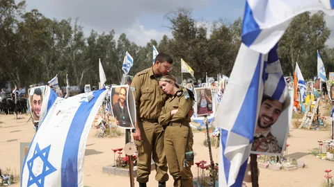 Family members visit the memorial site for victims killed during the Nova music festival in the October 07 Hamas attacks, near the border with Gaza Strip,southern Israel , 07 April 2024.