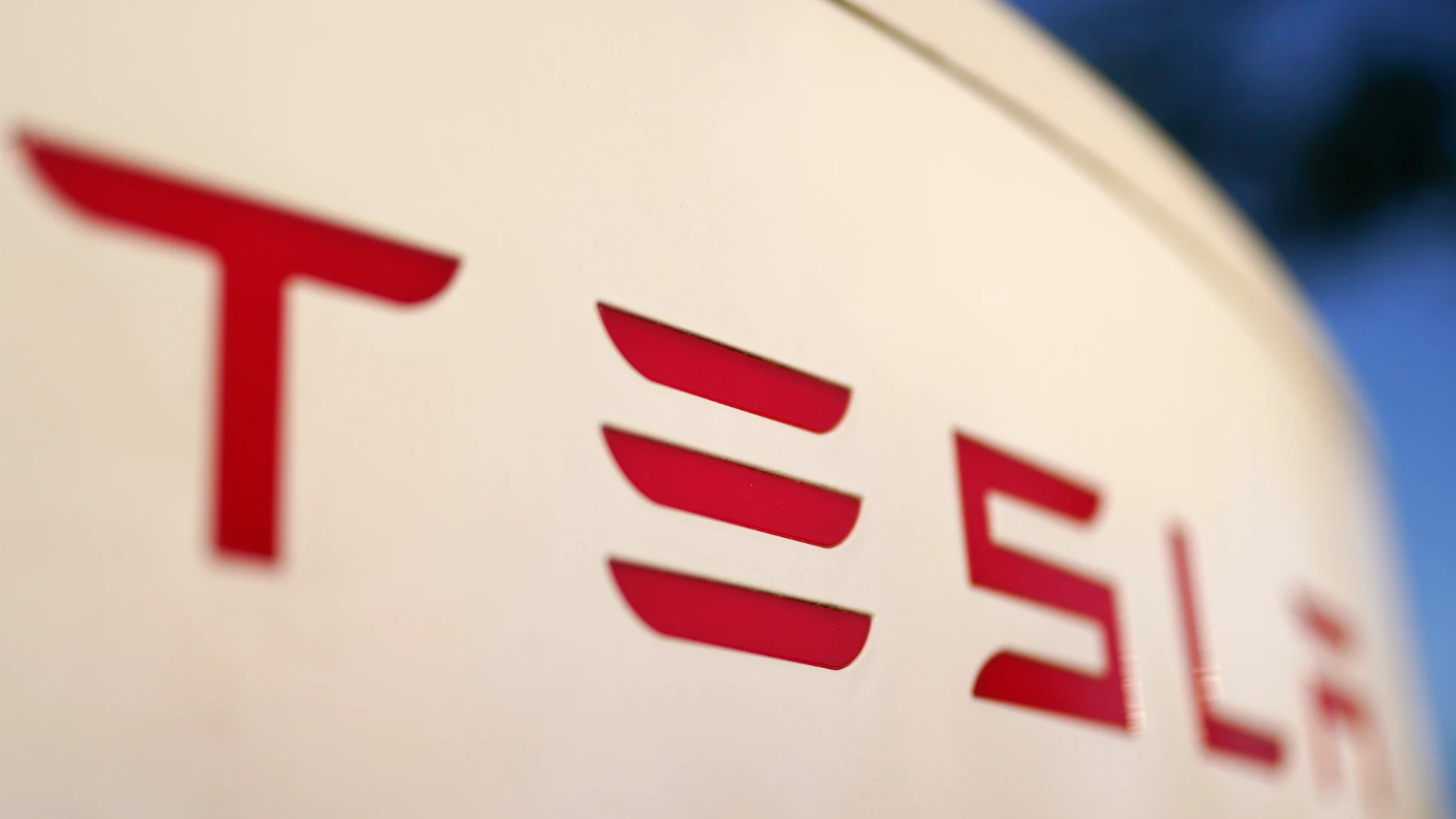 FILE - The logo for a Tesla Supercharger station is seen in Buford, Ga, April 22, 2021. Tesla has settled a lawsuit Monday, April 8, 2024, brought by the family of a Silicon Valley engineer who died in a crash while relying on the company’s semi-autonomous driving software. (AP Photo/Chris Carlson, File)
