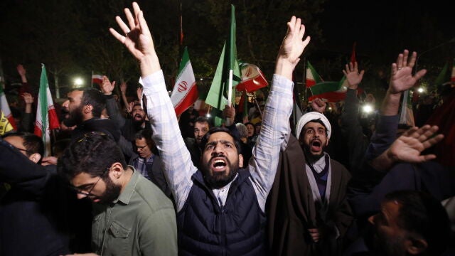 Iranians celebrate following Iran's launch of drone attacks towards Israel