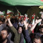 Iranians celebrate following Iran's launch of drone attacks towards Israel