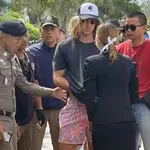 A handout photo made available by Royal Thai Police shows a Spanish chef, a murder suspect Daniel Sancho Bronchalo, (C) is escorted by Thai police officers during a crime reenactment at a scene in Koh Phangan island, southern Thailand