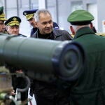 Russian Defence Minister Sergei Shoigu examines military equipments outside Moscow