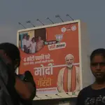Commuters are passing by Prime Minister Narendra Modi&#39;s poster ahead of the Lok Sabha election in Mumbai, India, on April 17, 2024. 