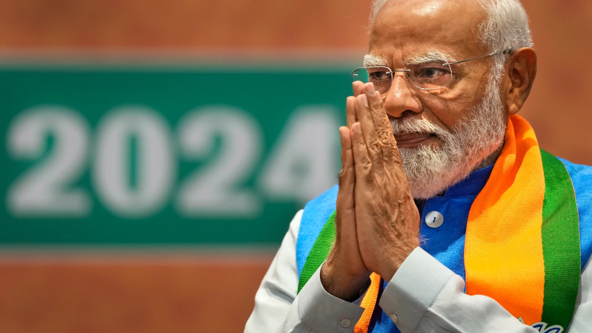 Indian Prime Minister Narendra Modi greets during the unveiling of his Hindu nationalist Bharatiya Janata party’s election manifesto in New Delhi, India, April 14, 2024. Modi is campaigning for a third term in the general election starting Friday. (AP Photo/Manish Swarup)